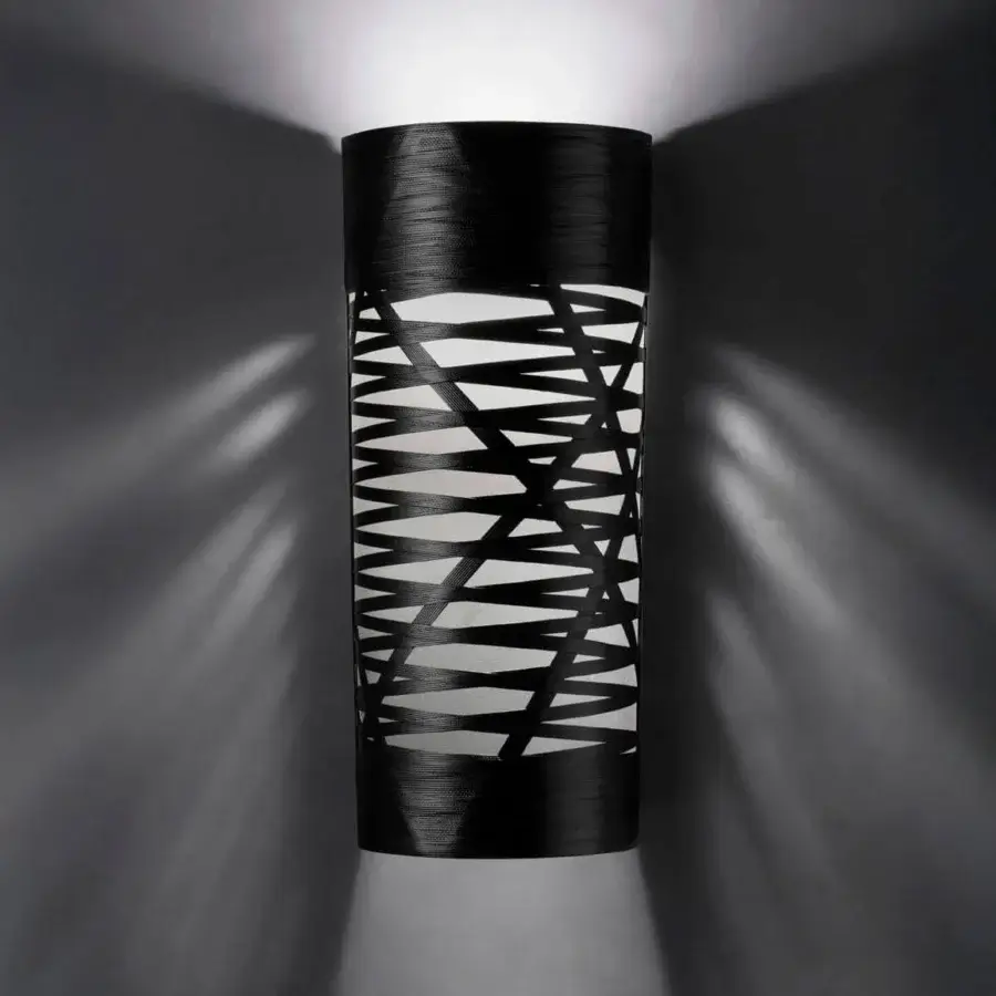 Distinguished Foscarini Tress wall lamp crafted in fiberglass-based composite with intersecting black epoxy powder bands projecting striped light