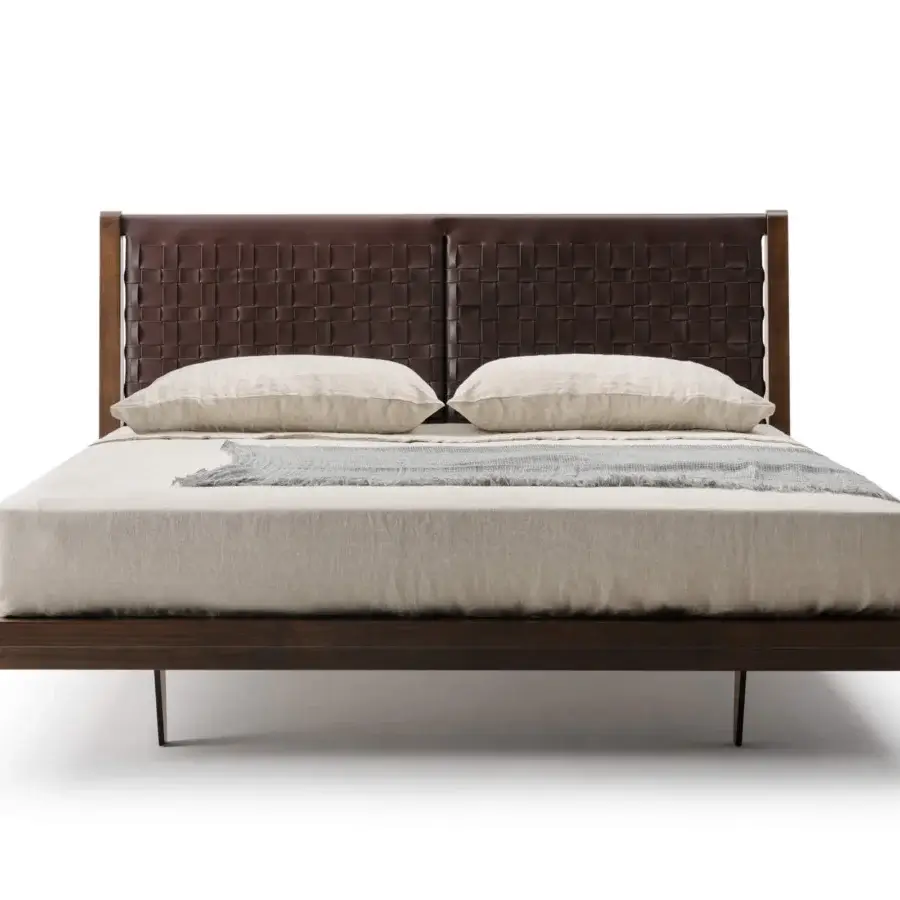 Sophisticated Turri Net bed with woven saddle leather headboard and coordinating dark brown finished wood frame