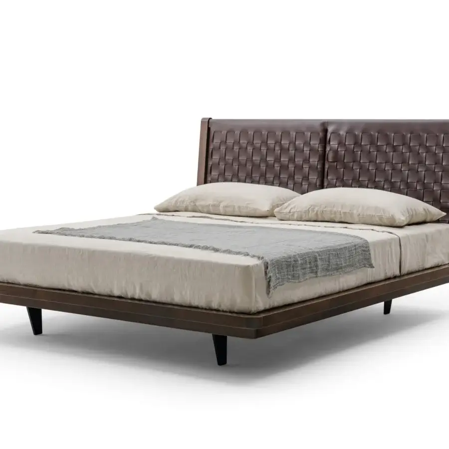 Elegant Turri Net bed with woven saddle leather headboard and dark brown wood frame with tapered black legs