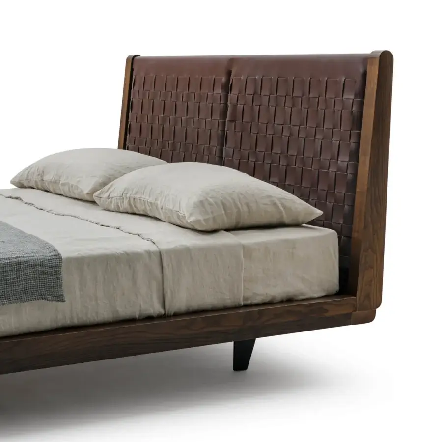 Sophisticated Turri Net bed with saddle woven headboard in dark brown material and wood frame construction