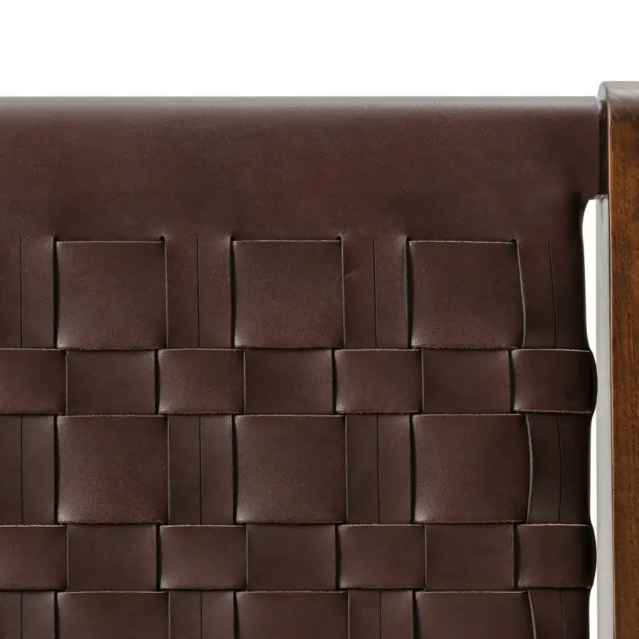 Elegant Turri Net bed with woven brown saddle leather and dark brown wooden frame showcasing skilled craftsmanship