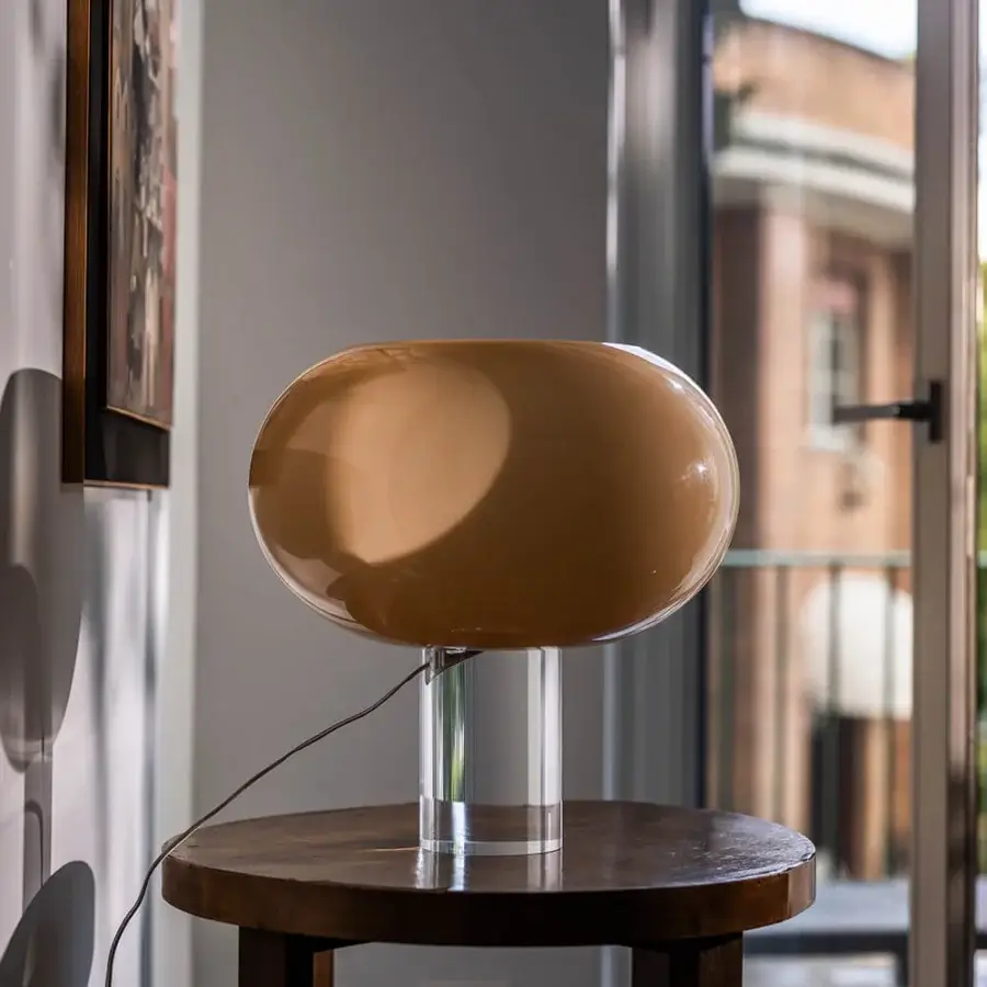 Elegant Foscarini Buds lamp with hand-blown cased glass diffuser in glossy caramel and mirror-polished transparent PMMA base