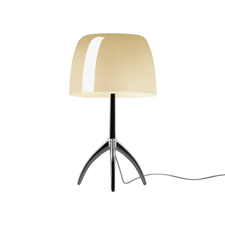 Foscarini Lumiere Grande table lamp, warm white translucent shade, black stem, polished metal tripod base, studio lighting.