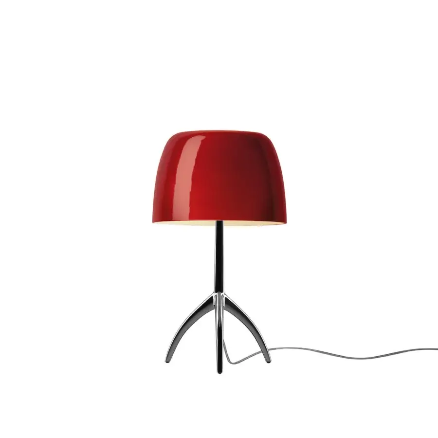 Foscarini Lumiere Piccola table lamp, cherry black, with flared red shade and silver stem on tripod gray metal legs.