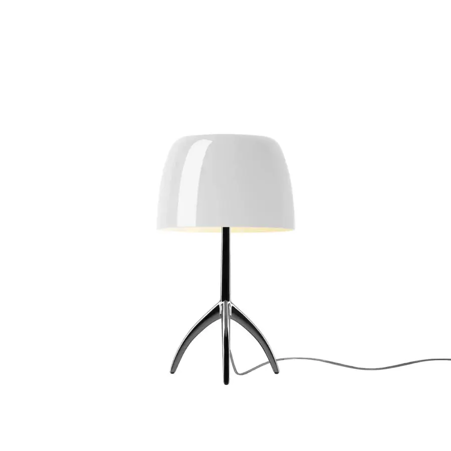 Foscarini Lumiere Piccola table lamp, white shade, black metal tripod base, polished chrome stem, minimalist modern design.
