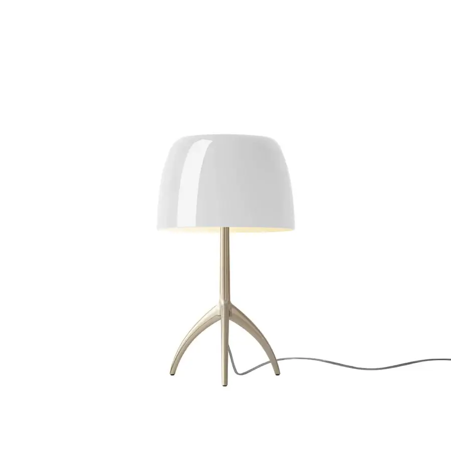 Foscarini Lumiere Piccola table lamp, white champagne, rounded opaque shade with glossy finish and curved metallic legs.