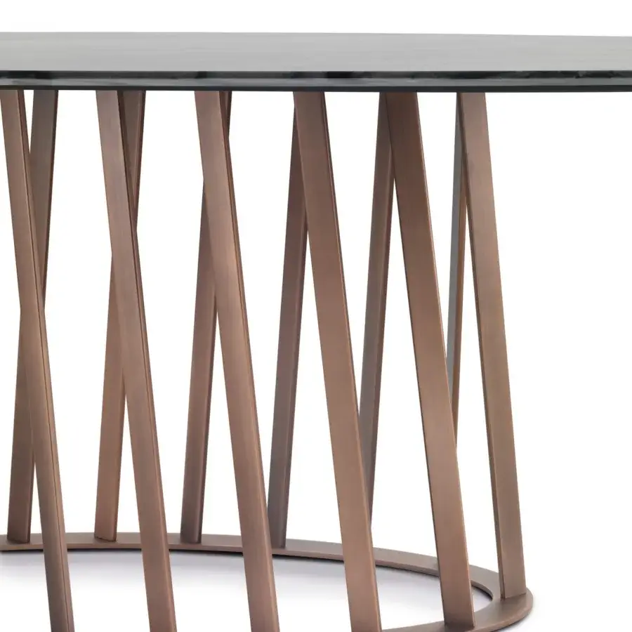 Distinguished Pacini & Cappellini Cosmo table with a tempered glass top and twisting bronze painted metal bars forming a geometric base