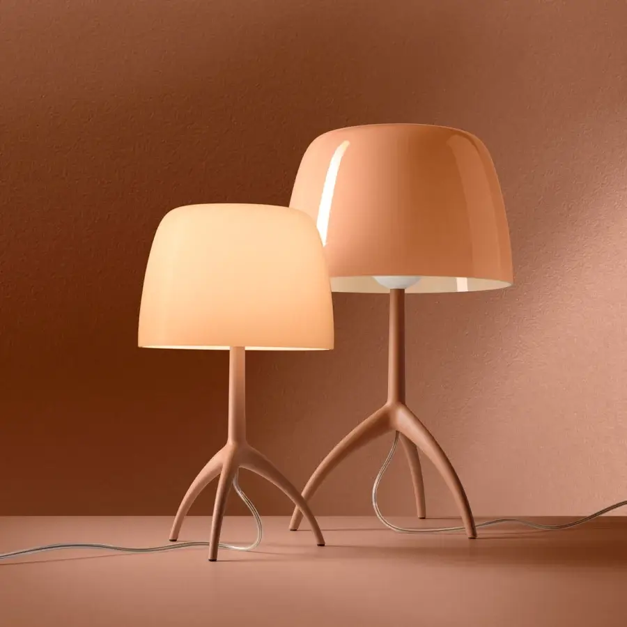 Elegant Foscarini Lumiere Nuances lamp with terracotta cased glass diffuser and matt liquid coated aluminum tripod base
