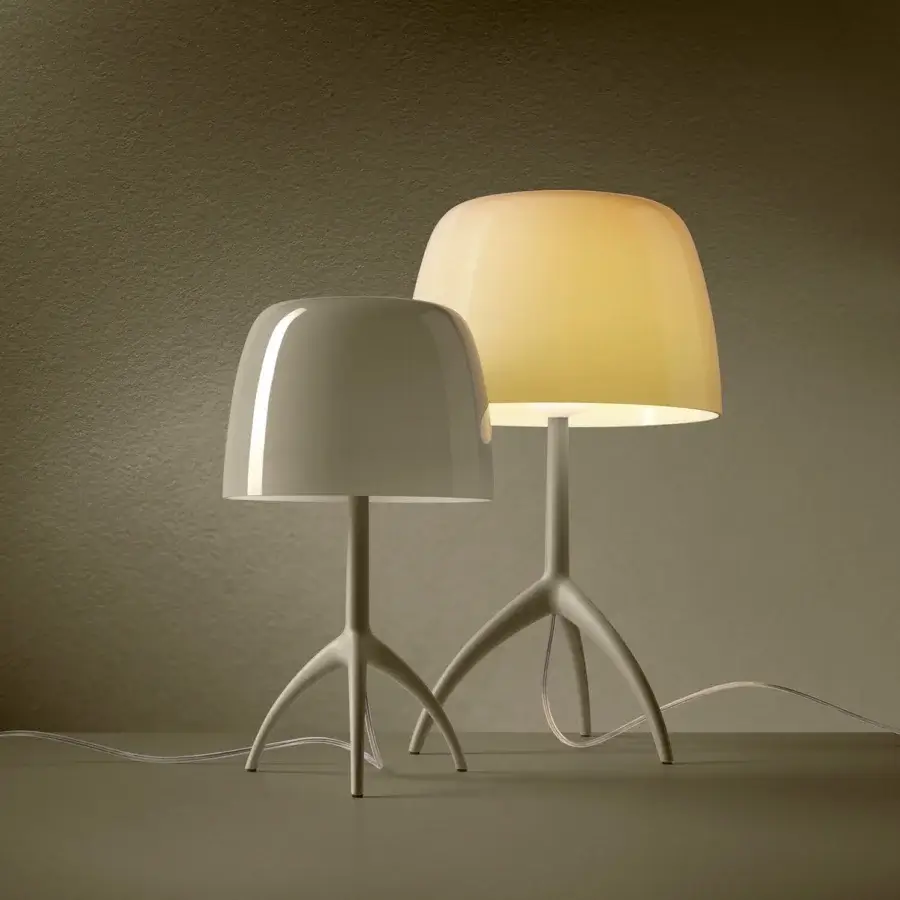 Exceptional Foscarini Lumiere Nuances lamp with neutral gray tripod base and glossy cased glass diffuser crafted in liquid coated aluminum