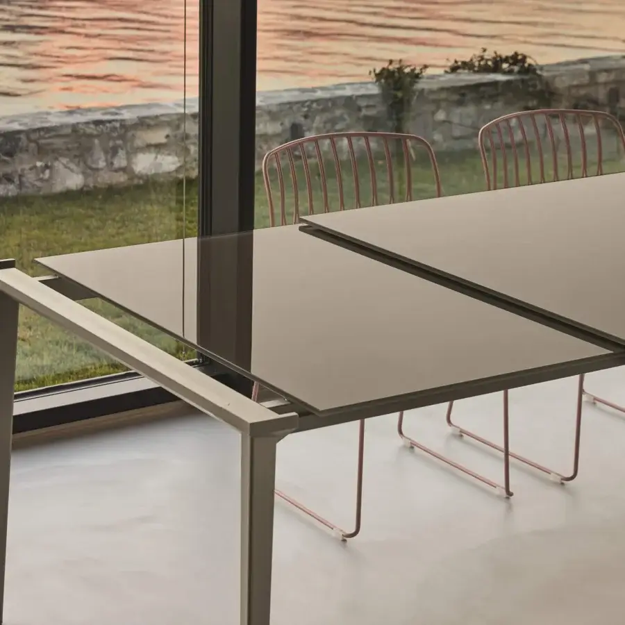 Superior Bontempi Echo table crafted in matte gray-brown glass and metal with an extendable design