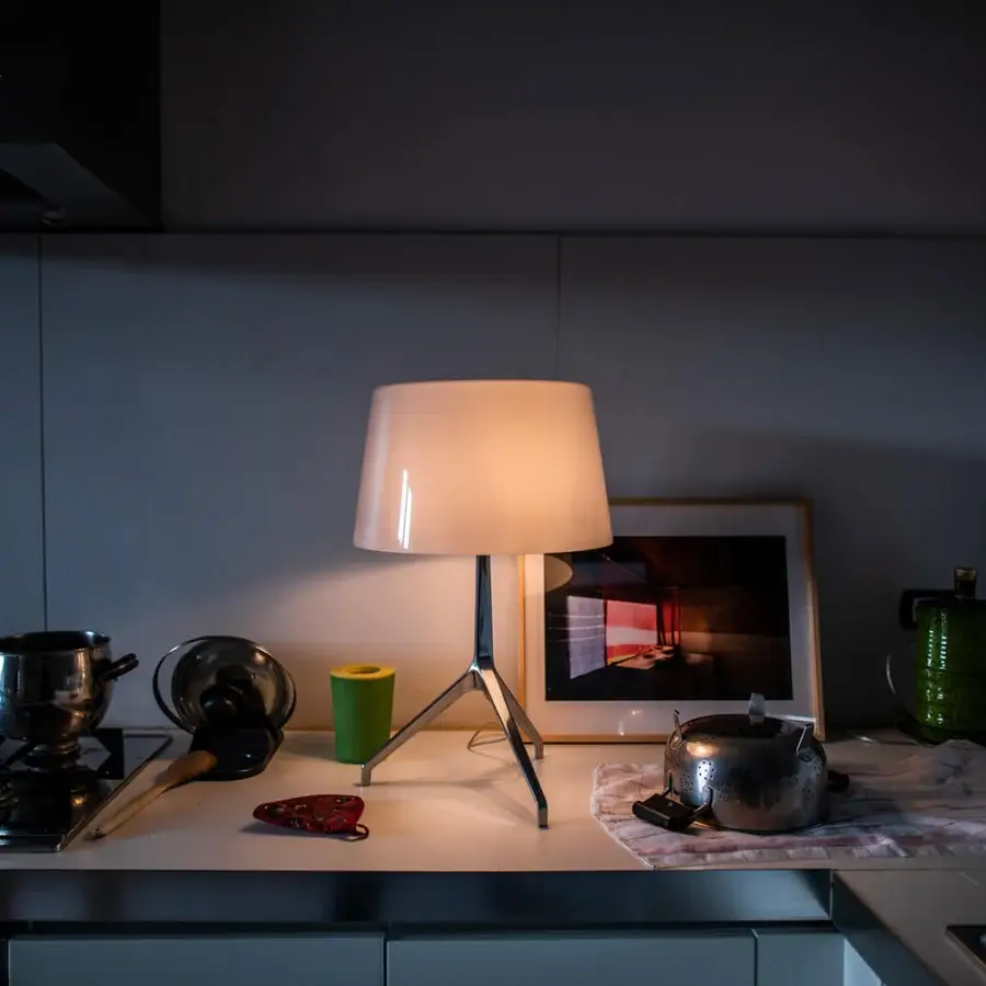 Distinguished Foscarini Lumiere table lamp with hand-blown cased glass diffuser and hand-finished polished die-cast aluminum base