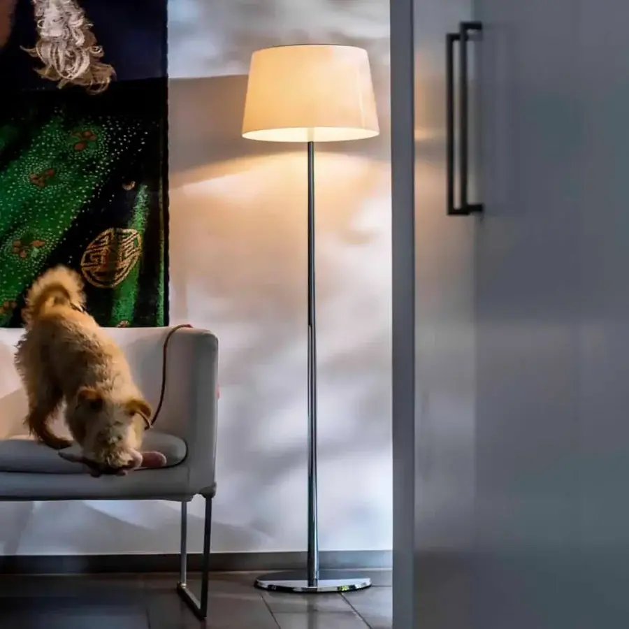 Distinguished Foscarini Lumiere floor lamp with hand-blown cased glass diffuser and black chrome liquid coated die-cast aluminum base