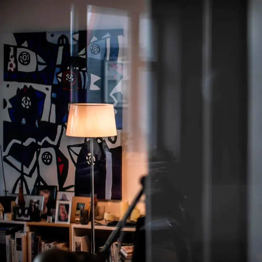 Distinguished Foscarini Lumiere floor lamp with hand-blown cased glass diffuser and liquid coated die cast aluminum base