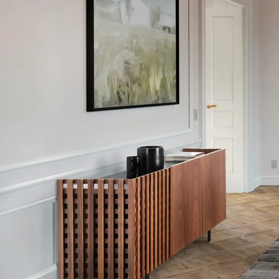 Distinguished Pacini & Cappellini Aurora sideboard with alternating solid wood and grid doors, black lacquered interior, graphite metal legs with brass accents