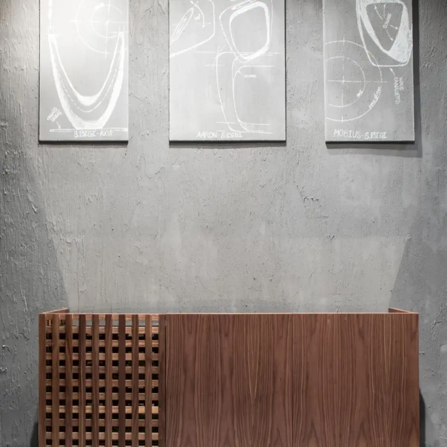 Exceptional Pacini & Cappellini Aurora sideboard with solid wooden doors and graphite metal base, showcasing a medium-toned brown finish with brass accents
