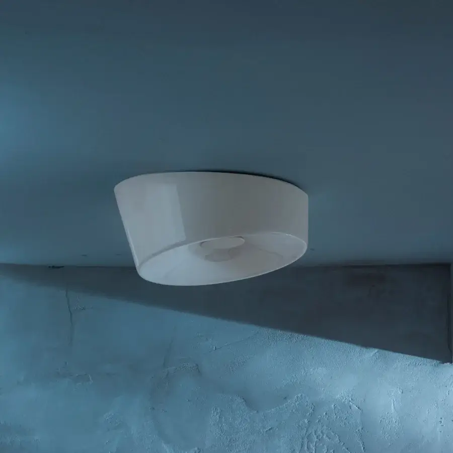 Distinguished Foscarini Lumiere ceiling lamp with hand-blown cased glass diffuser and glossy white finish crafted in epoxy powder-coated metal