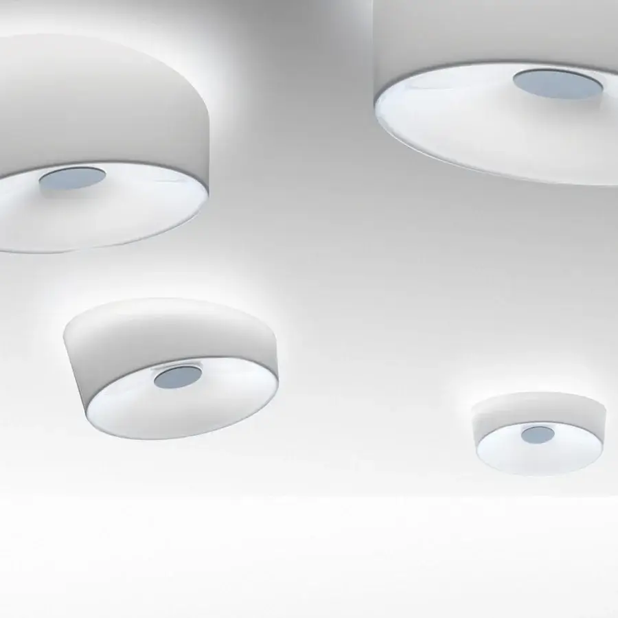 Distinguished Foscarini Lumiere ceiling lamp with hand-blown cased glass and light gray powder-coated metal mount boasts a glossy white finish