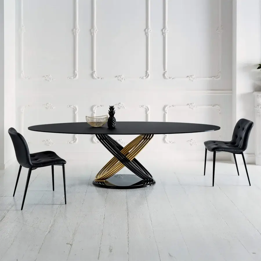 Distinctive Bontempi Fusion table with interwoven black and gold metal base supporting a smooth dark tabletop