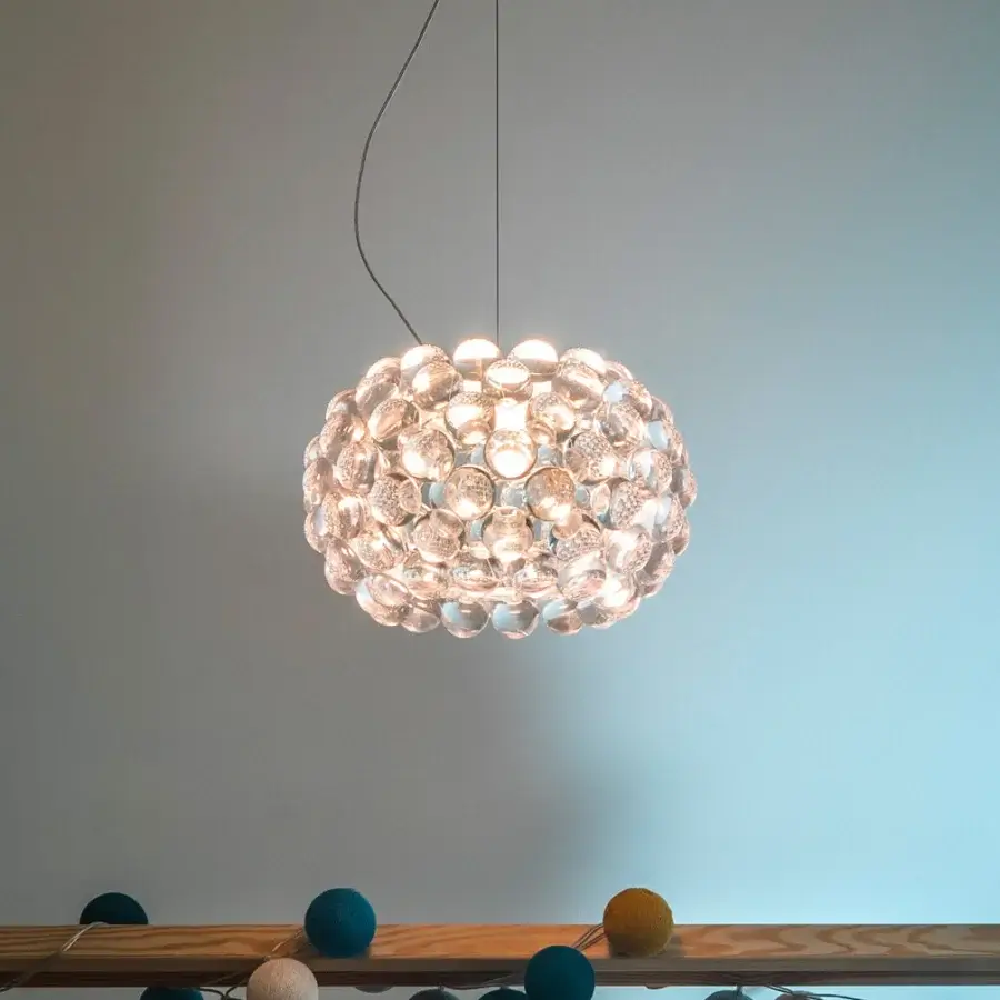 Innovative Foscarini Caboche Plus suspension lamp with clear PMMA spheres affixed to a transparent arched PC structure and glossy finish