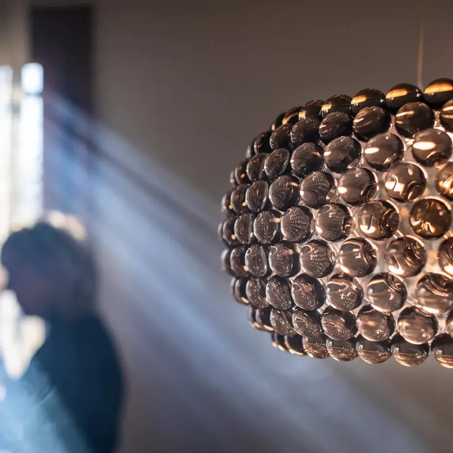 Elegant Foscarini Caboche Plus suspension lamp with amber transparent PMMA spheres and satin finish PMMA diffuser