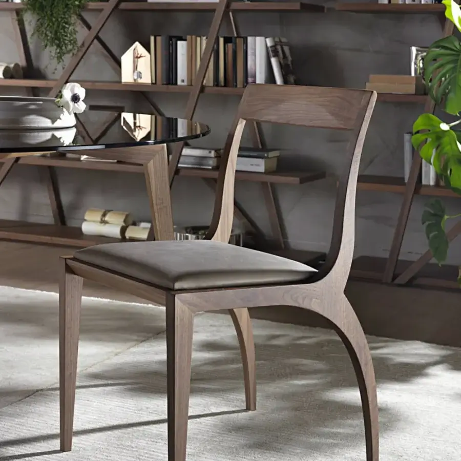 Refined Pacini & Cappellini Thelma chair with medium brown wood and complementary fabric upholstery in a matte finish