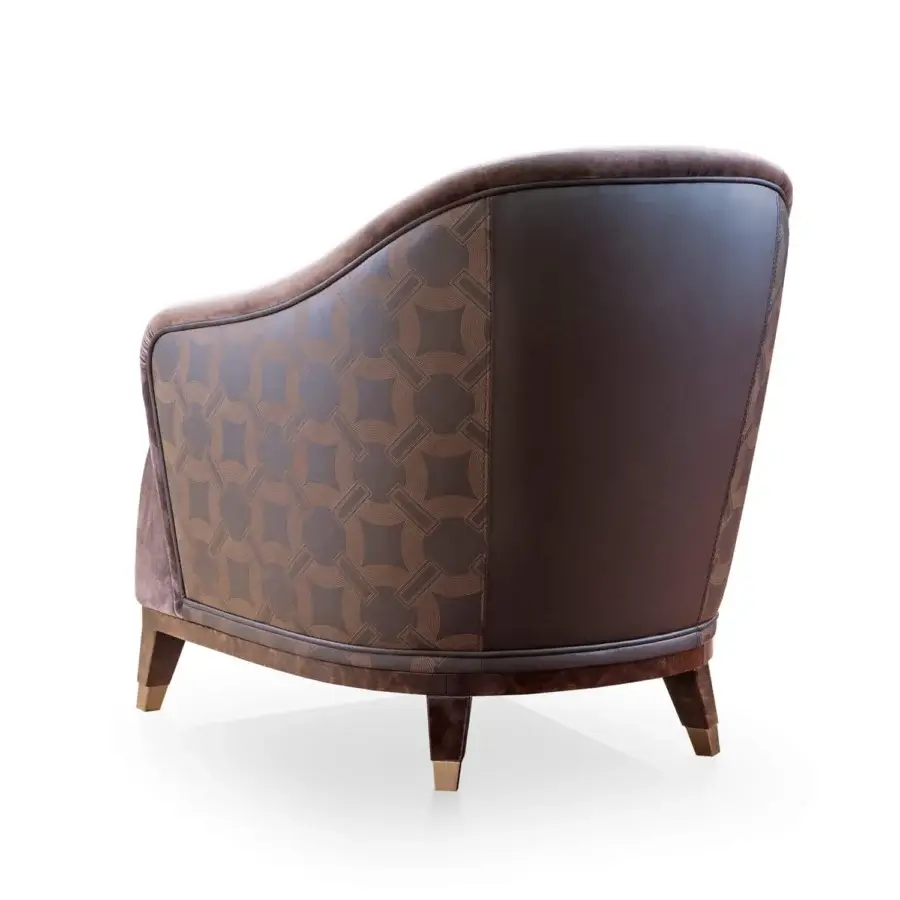 Superior Turri Jolly lounge chair with enveloping lines crafted in brown geometric textile and smooth solid material with velvet trim