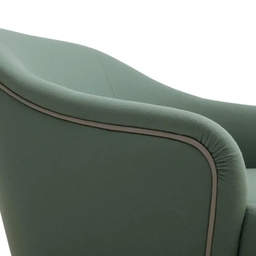 Distinguished Turri Jolly lounge chair upholstered in muted green textured textile with light brown trim