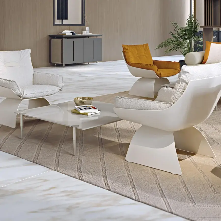 Elegant Turri Silhouette lounge chair with enveloping white cushions upholstered in textured textile and glossy sculptural frame