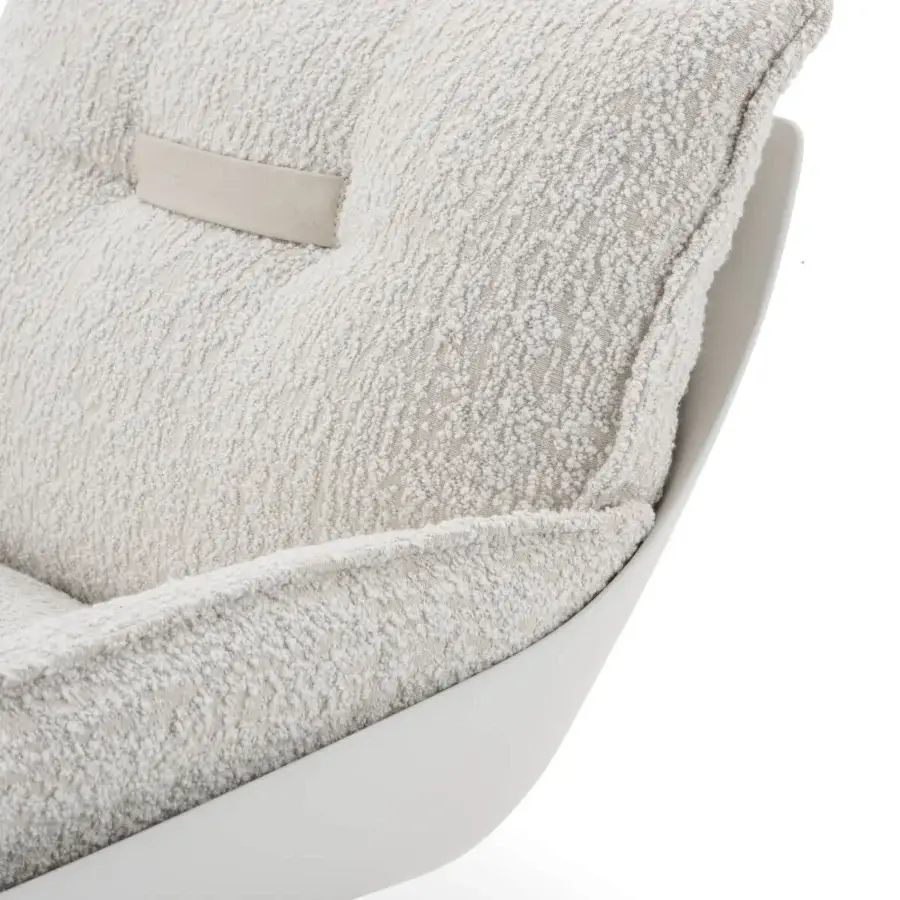 Exceptional Turri Silhouette lounge chair with soft lines upholstered in textured off-white textile and glossy white frame