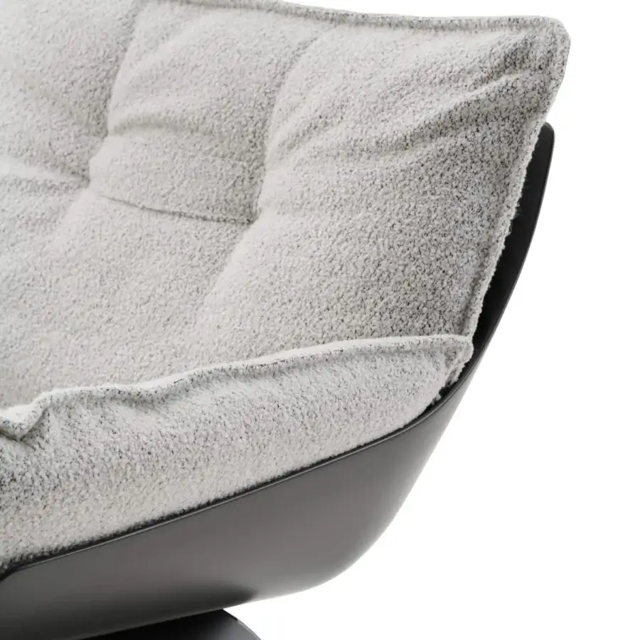 Distinguished Turri Silhouette lounge chair with enveloping lines in soft grey textured textile and sleek dark matte base