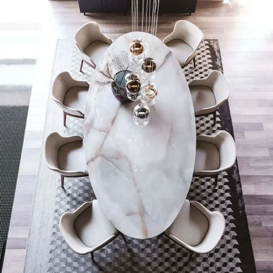 Harmonious Cattelan Italia Roll table with light Marmi ceramic top and dark wooden legs showcasing balanced asymmetry