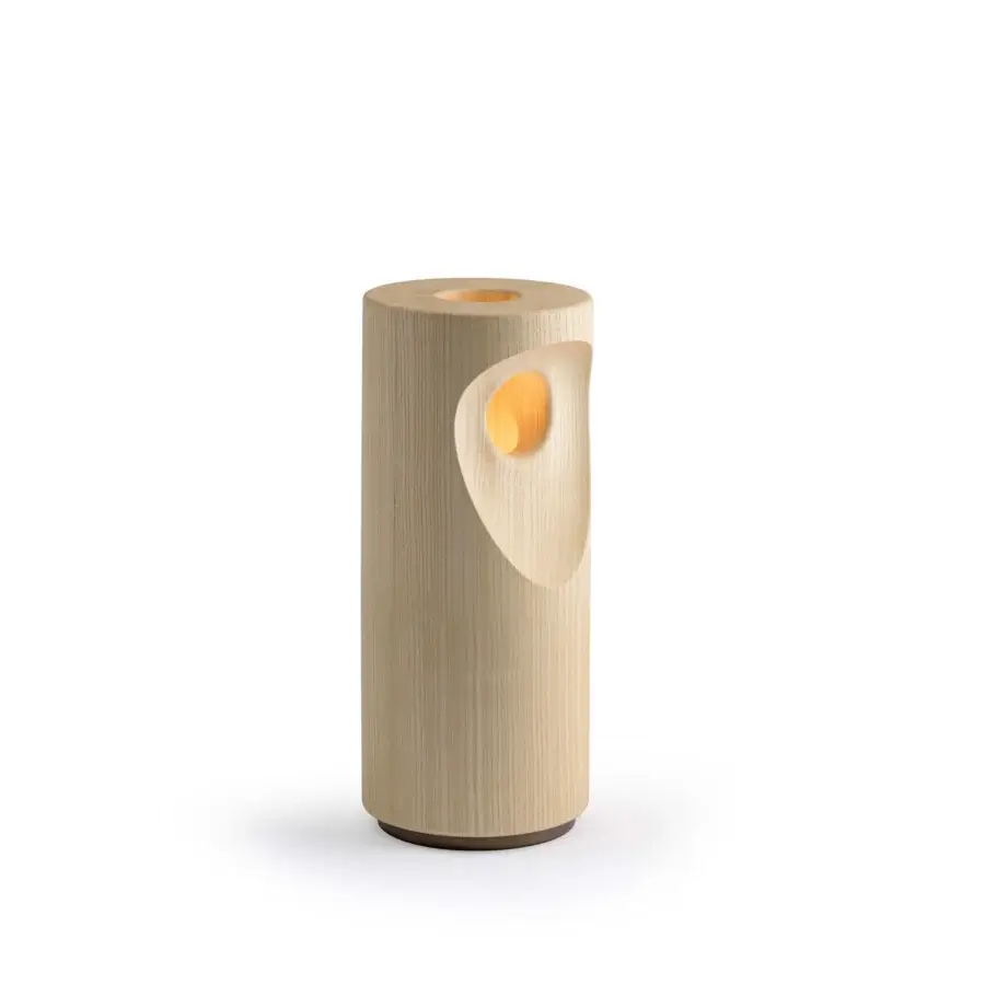 Exceptional Turri Silhouette table lamp, a luminous sculpture crafted in light-toned wood with a varnished metal base