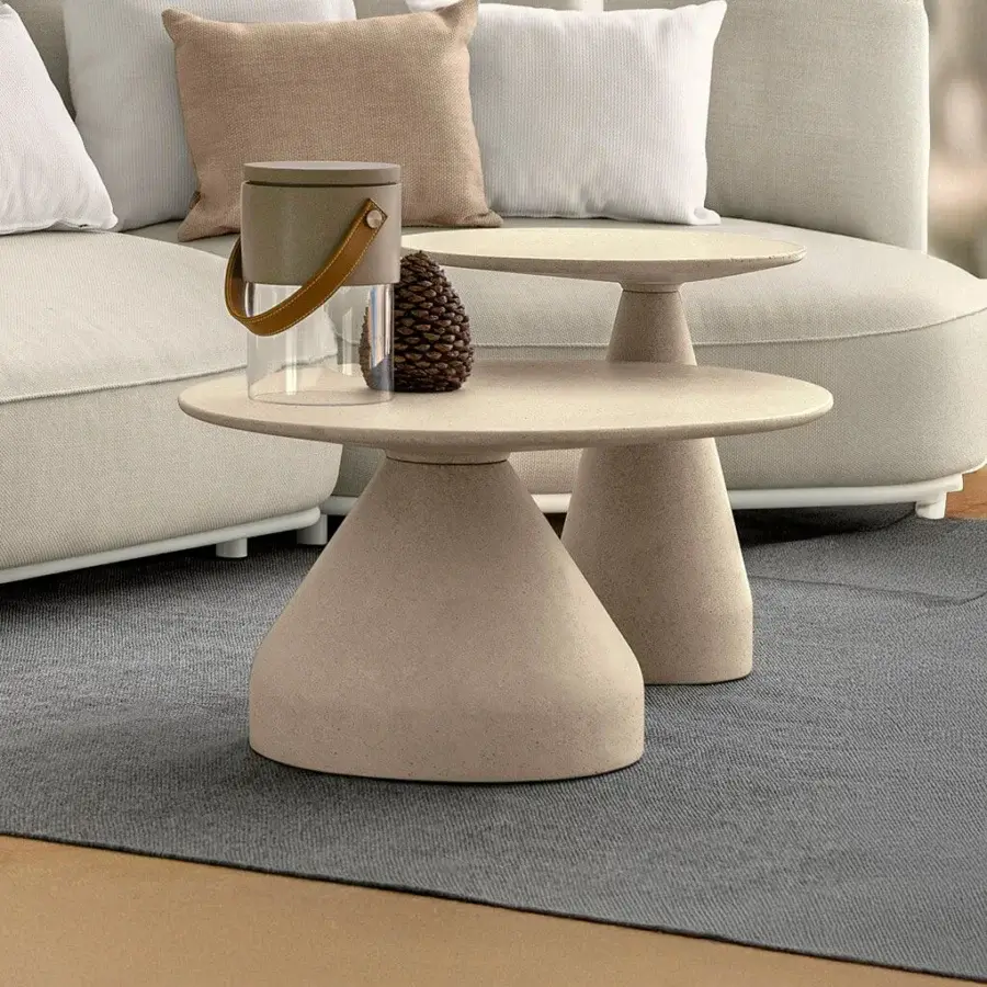 Superior Talenti Plaza coffee table crafted in light beige concrete with a textured matte finish and geometric shapes