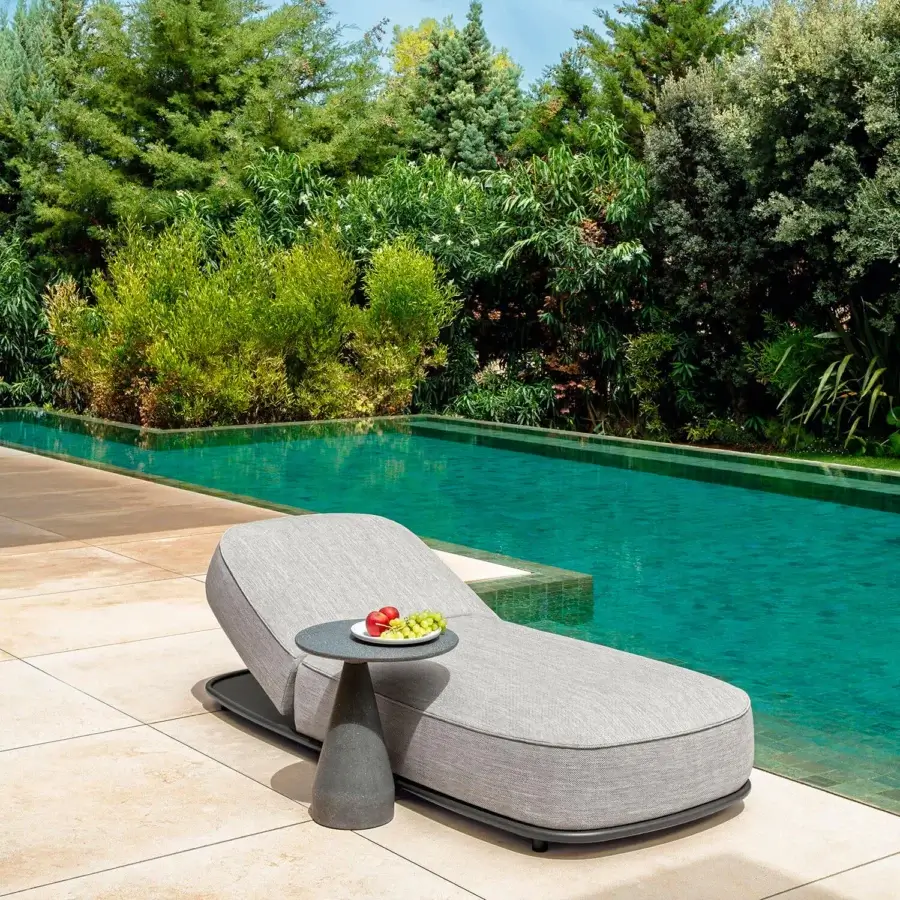 Distinguished Talenti Plaza coffee table with soft lines and a dark gray concrete finish for modern outdoor spaces