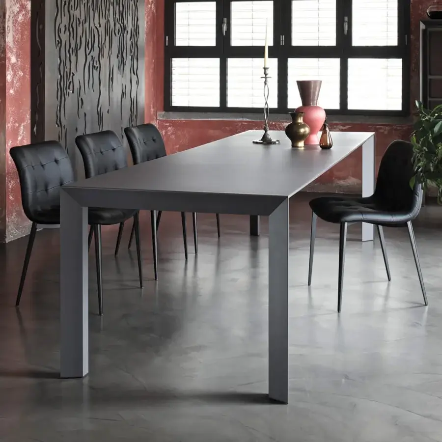 Elegant Bontempi Genio extendable table with dark gray smooth surface and clean lines for versatile functionality