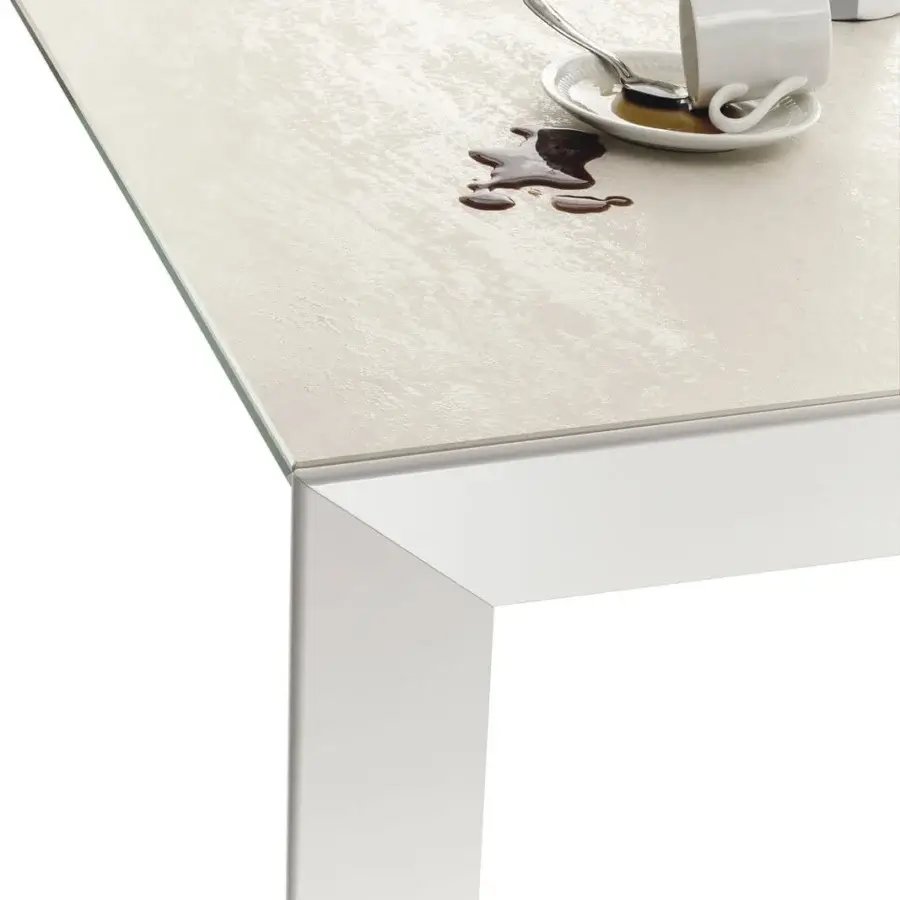Exclusive Bontempi Genio extendable table with light cream matte tabletop and matching metal legs exhibiting a modern aesthetic