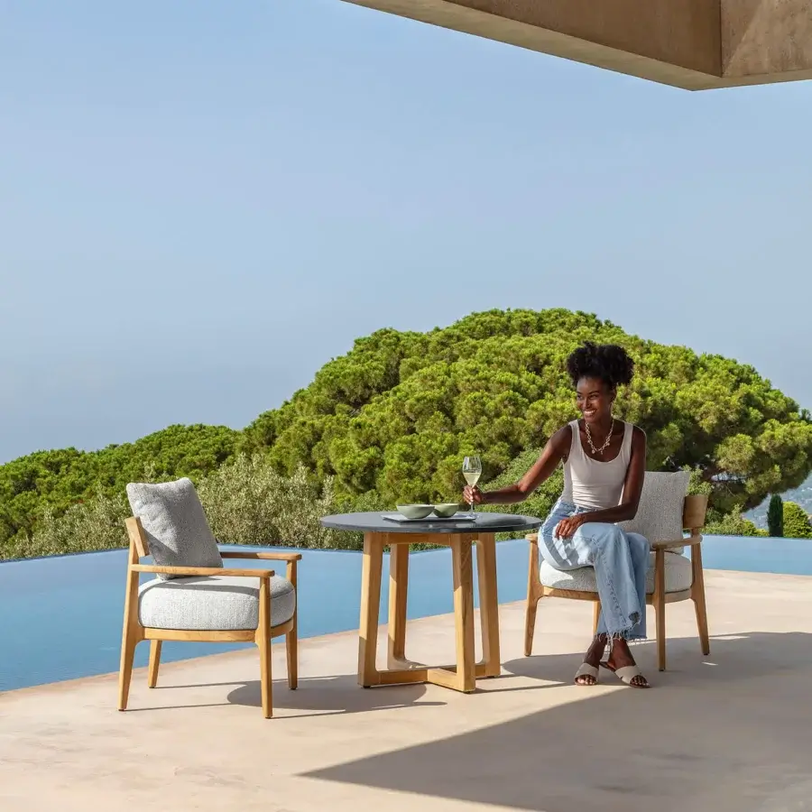 Distinguished Talenti Ever lounge chair with light grey upholstery and smooth matte light tone wooden structure