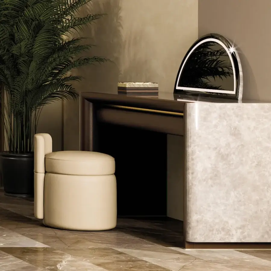 Exclusive Turri Madison ottoman with cylindrical form and stacked design in light beige textile upholstery with gold button detail