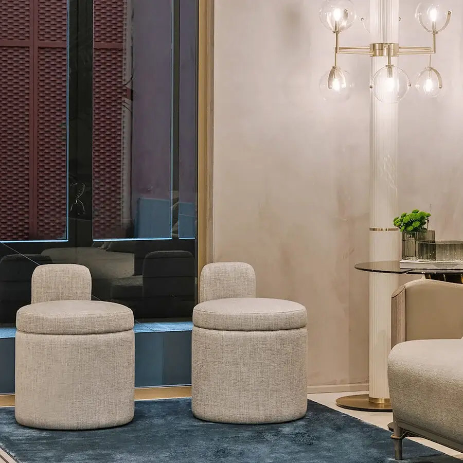 Distinguished Turri Madison ottoman with light neutral beige textile upholstery and gold button detail
