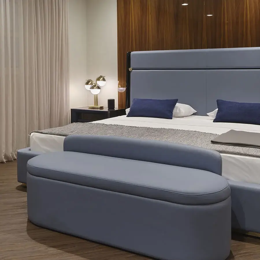 Exclusive Turri Madison bench in muted blue-gray leather or fabric with a refined gold button accent and matte finish