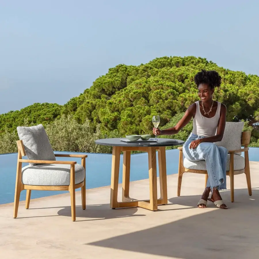 Superior Talenti Ever table with dark matte tabletop and light-toned wooden legs connected by a square support