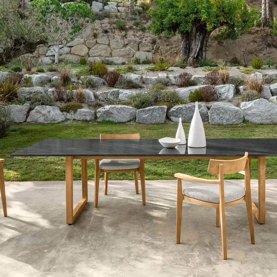 Superior Talenti Ever table with dark tabletop and geometric light wood legs creating a striking contrast