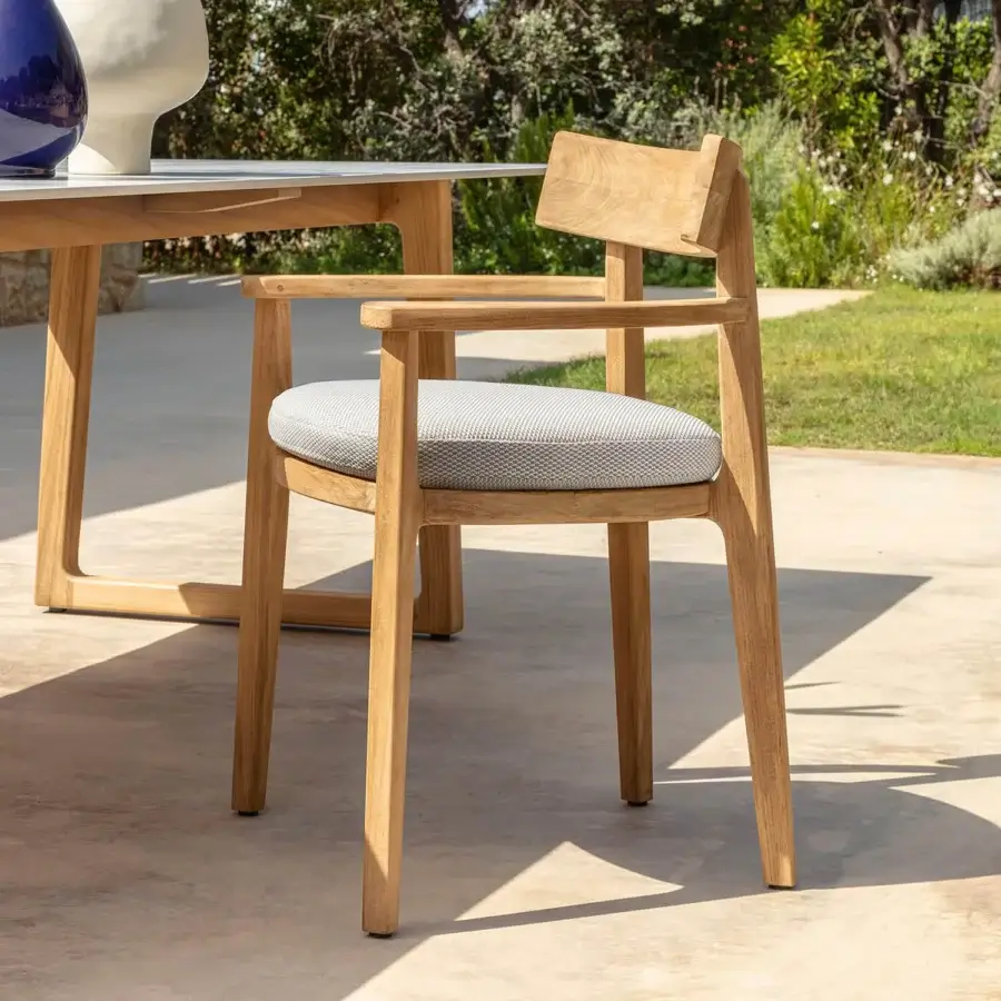 Sophisticated Talenti Ever armchair with light wood structure and light gray textured seat cushion in smooth matte finish