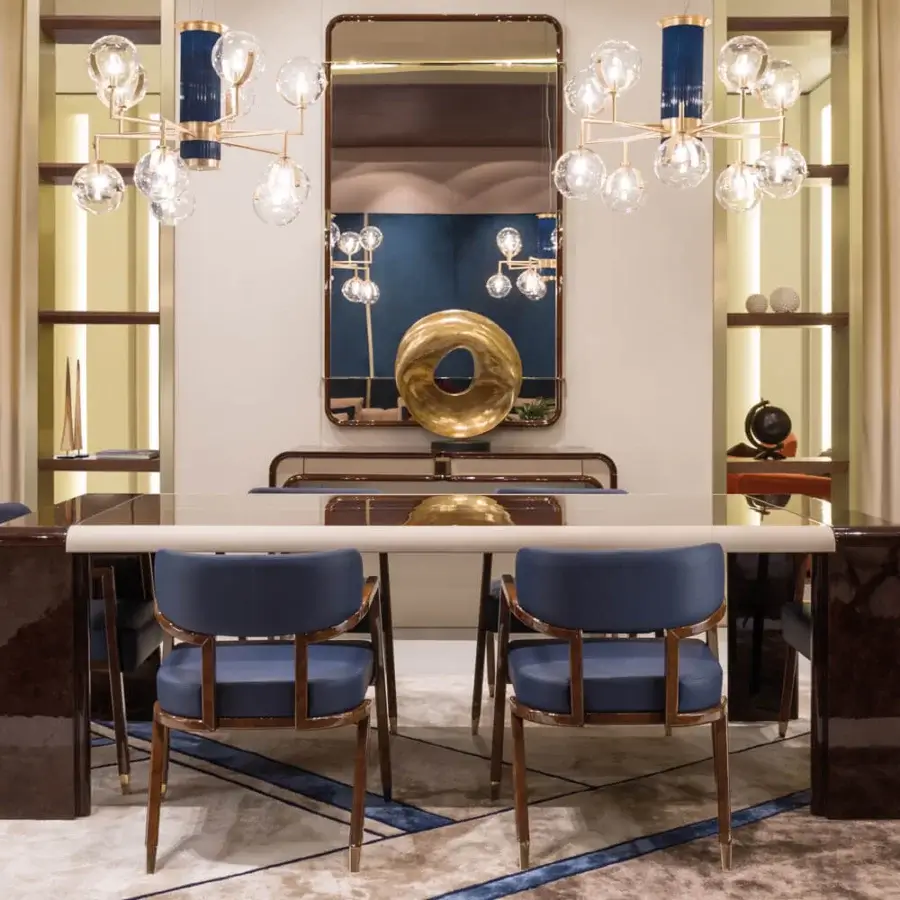 Lavish Turri Madison armchair showcases geometric shaping upholstered in vibrant blue textile with light gold metal feet and glossy dark brown wood