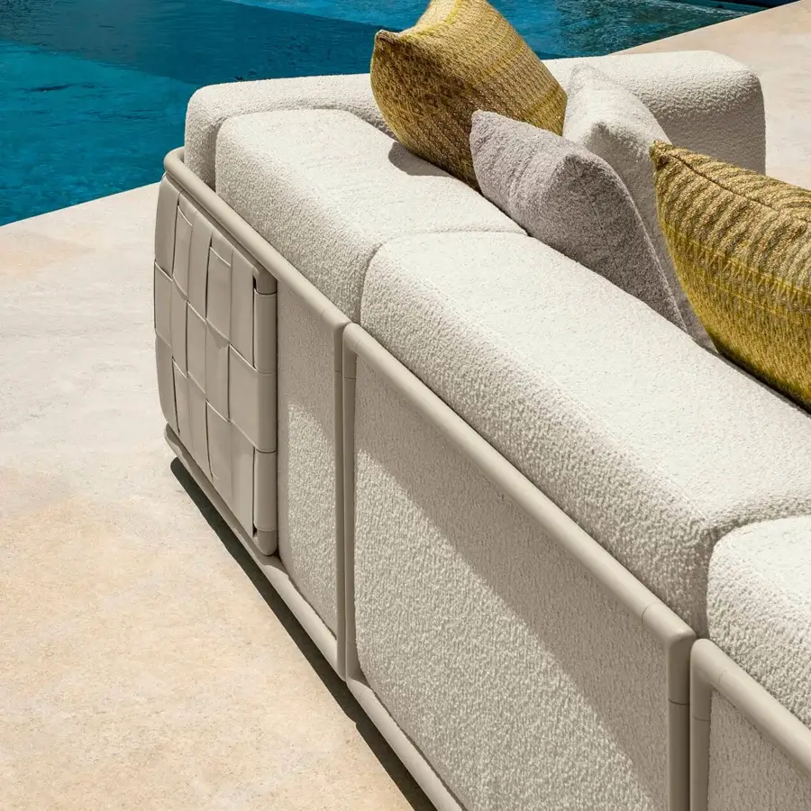 Sophisticated Talenti Tressé sofa with woven eco-leather bands and matte off-white textile complemented by yellow and grey cushions