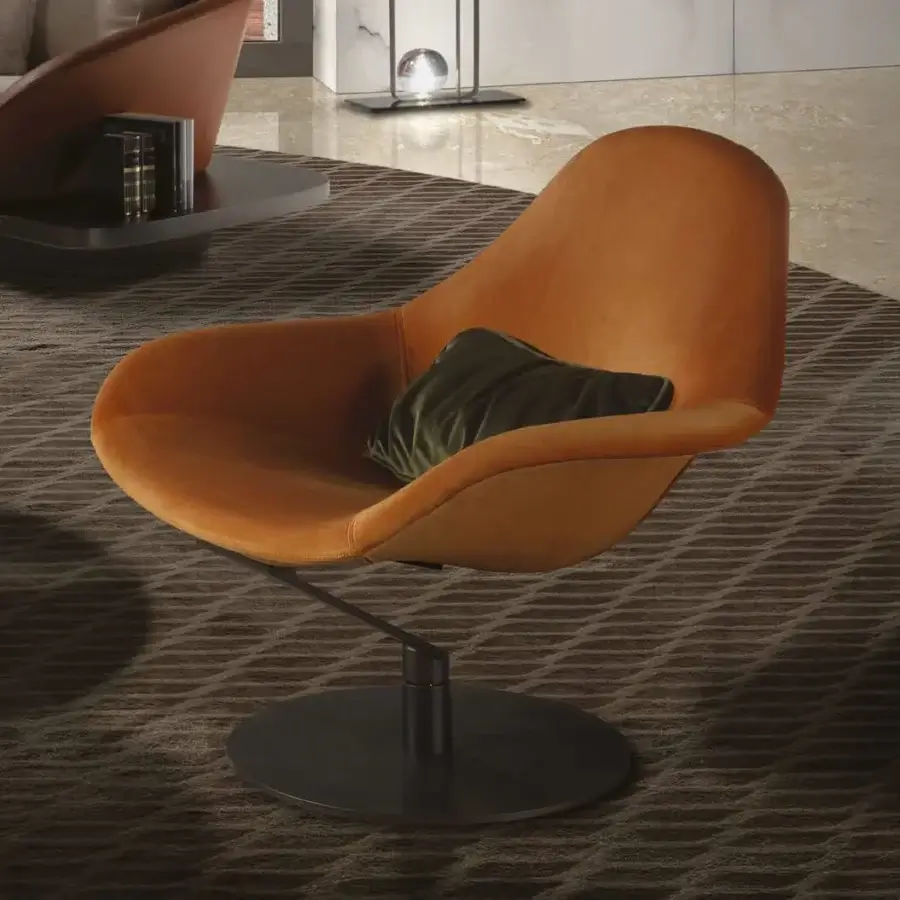 Exceptional Reflex Zenith lounge chair upholstered in dark orange textile with a glazed stainless steel swiveling base and green pillow