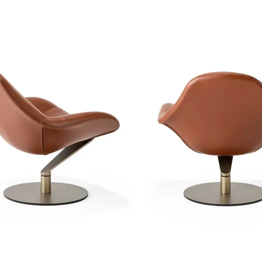 Lavish Reflex Zenith lounge chair with supple brown leather upholstery and a glazed stainless steel base