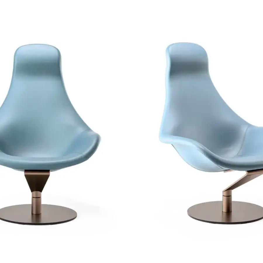 Elegant Reflex Zenith lounge chair upholstered in light blue fabric or leather with glazed stainless steel base