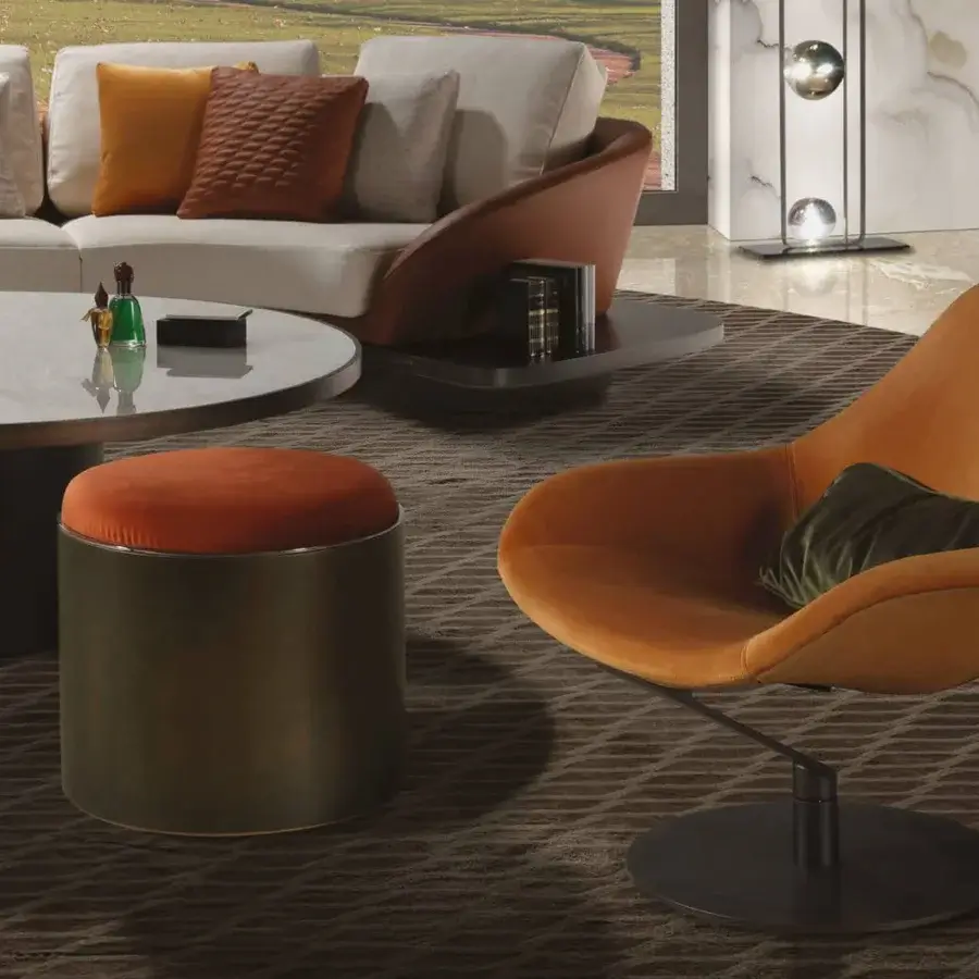 Exceptional Reflex Zenith lounge chair with warm orange textile upholstery, a swiveling glazed stainless steel base and dark green pillow