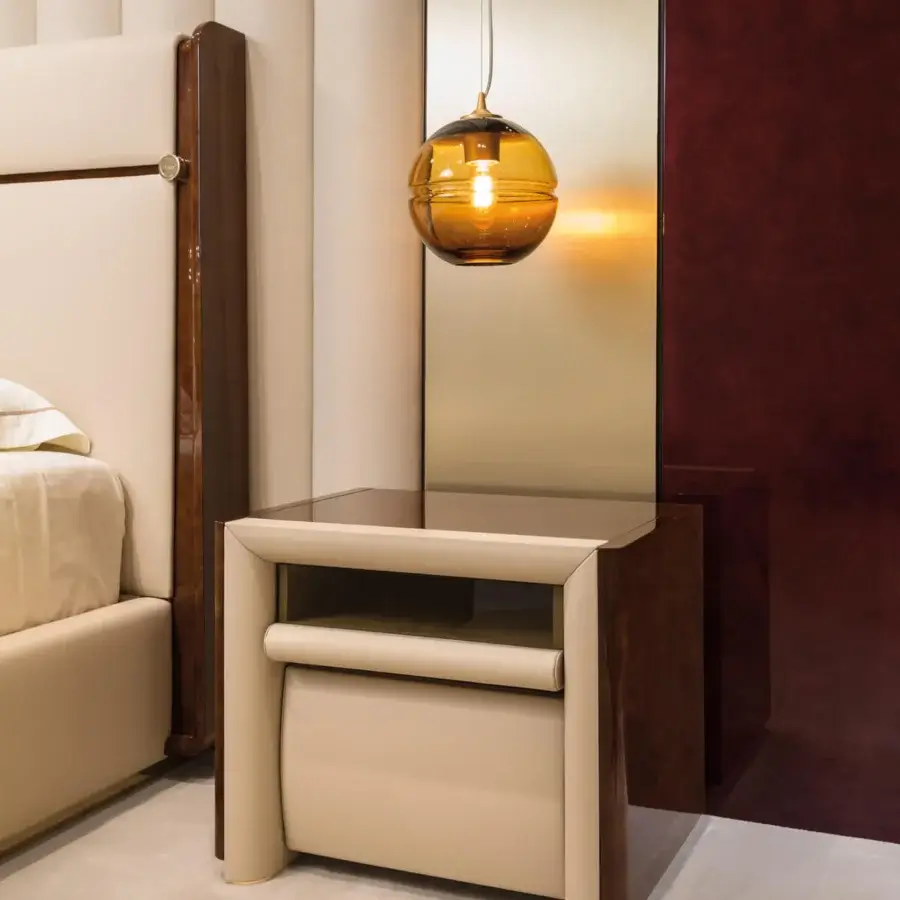 Exclusive Turri Madison bed with glossy dark-lacquered wood and light beige leather detailing accented with gold metal hardware